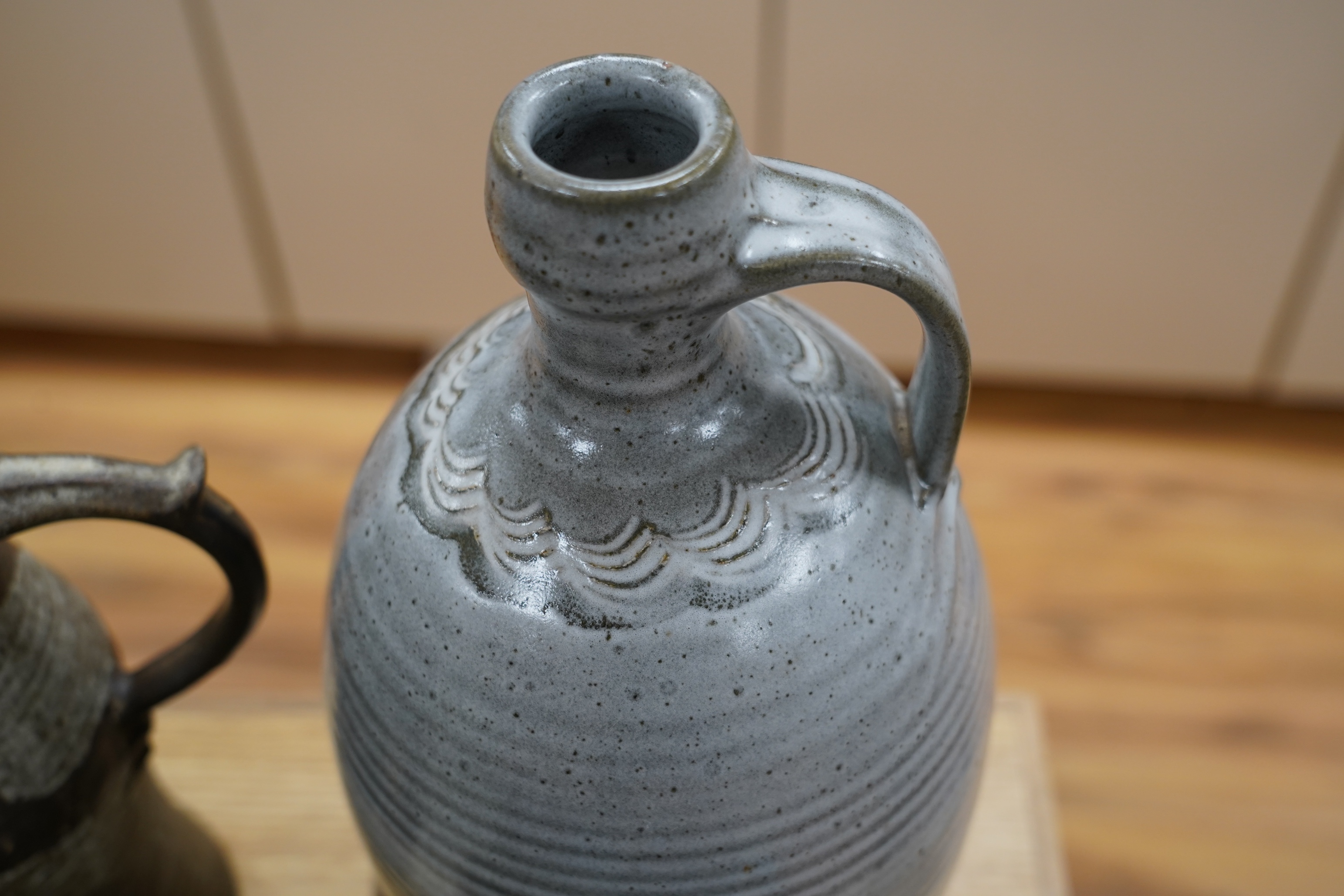 Nine studio pottery jugs, a vase and a bowl, etc. (11)